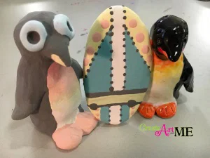 Ceramic Surfer Dude Penguin and surfboard