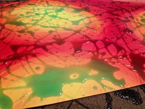 Liquid soap drizzles over surface