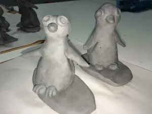 Ceramic Surfer Dude Penguin and surfboard