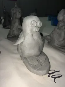 Ceramic Surfer Dude Penguin and surfboard