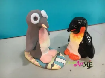 Ceramic Surfer Dude Penguin and surfboard